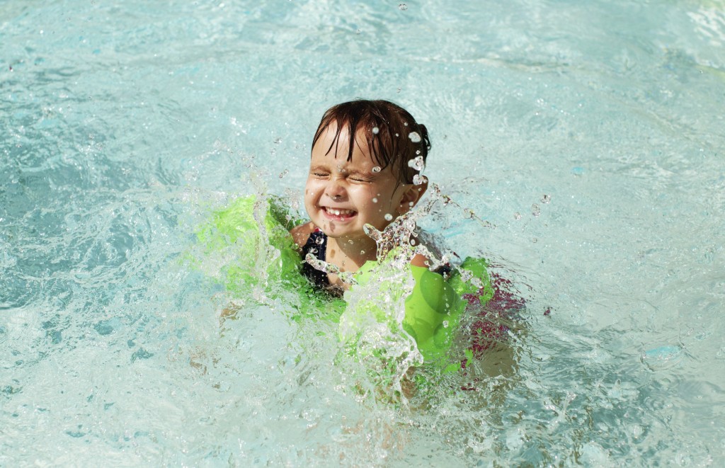 little girl swimming in pool - iStock_000047861044_Large